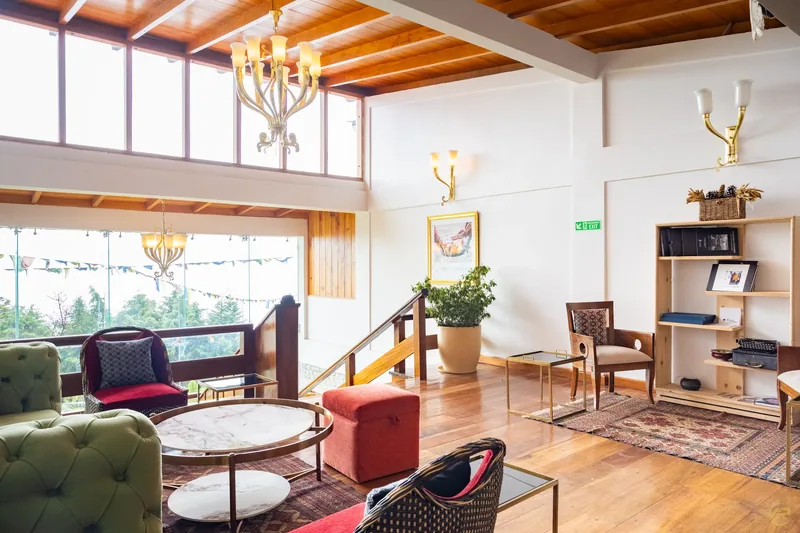 A sunlit lounge with sliding wood-panel doors