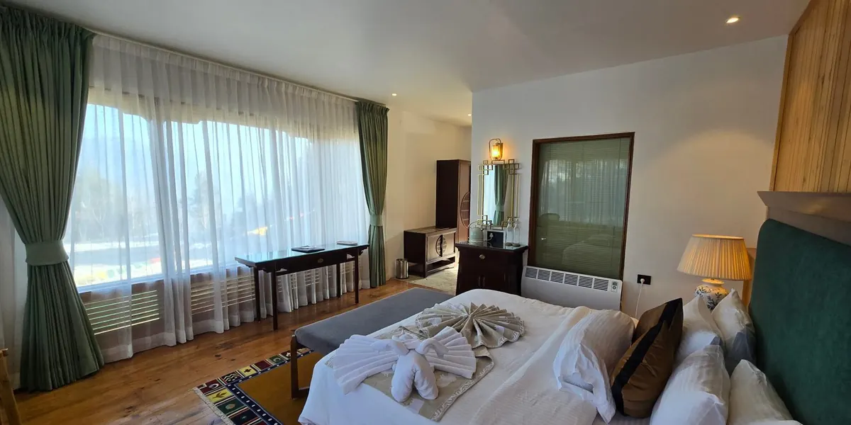 Curtains drawn back from the wide window of the Timilo Classic, the room full of morning light