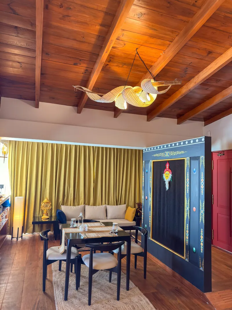 Long sofa, yellow curtains and the painted door — Presidential Suite, Timilo Boutique