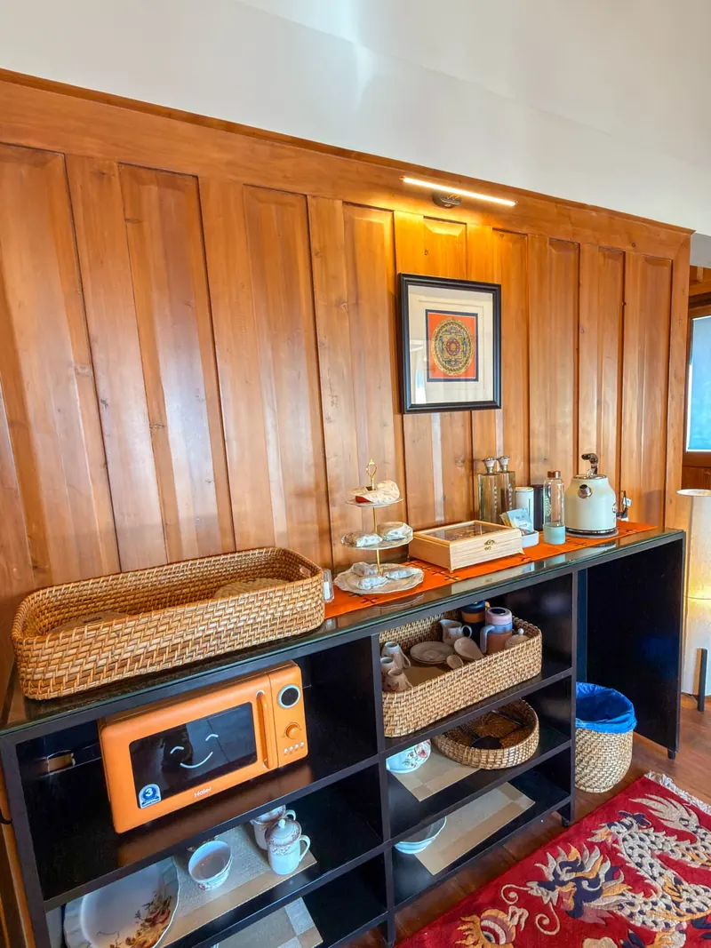 The pantry shelf — tea, coffee and a Tibetan rug — Presidential Suite, Timilo Boutique